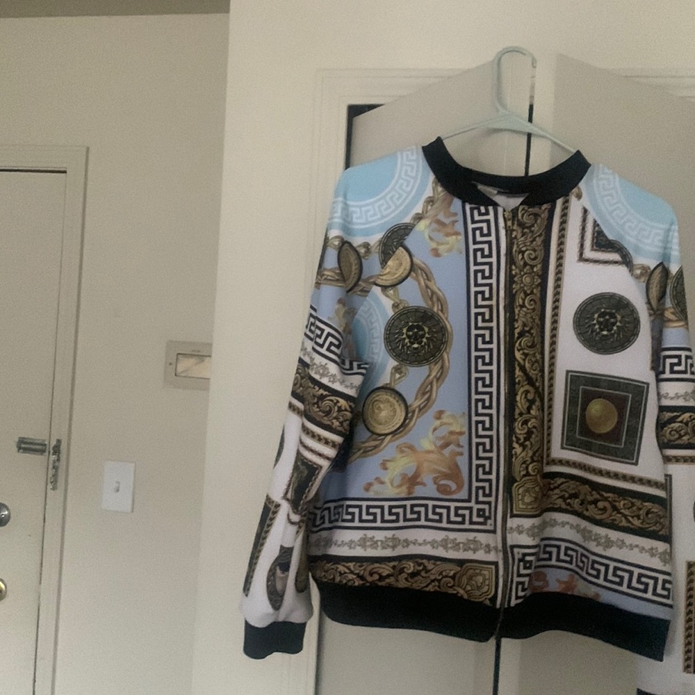 A ladies shirt jacket mixed in color and very stylish